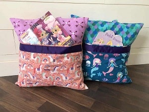 Reading pillow with pocket to hold books